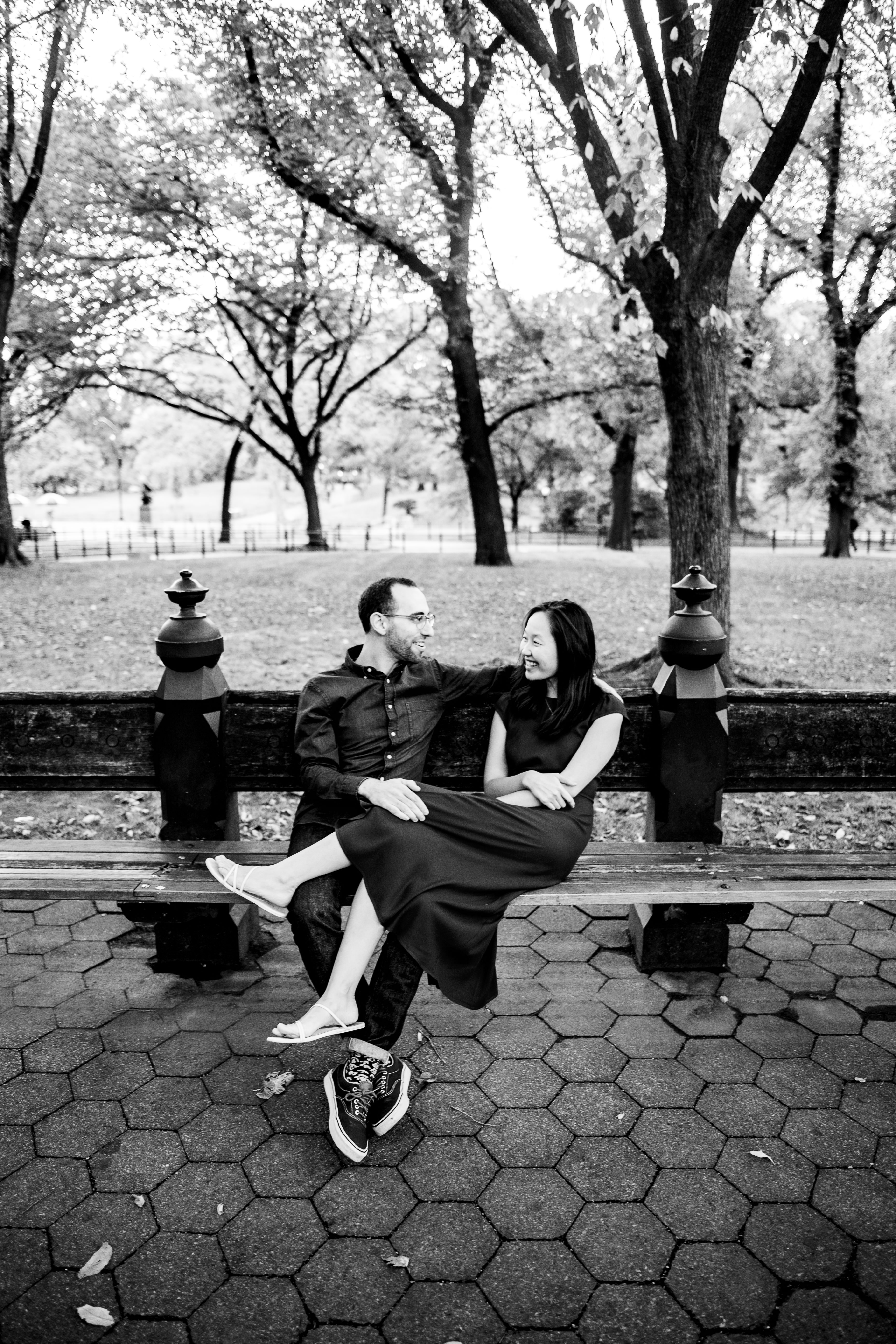 Engagement — couple on park bench in autumn