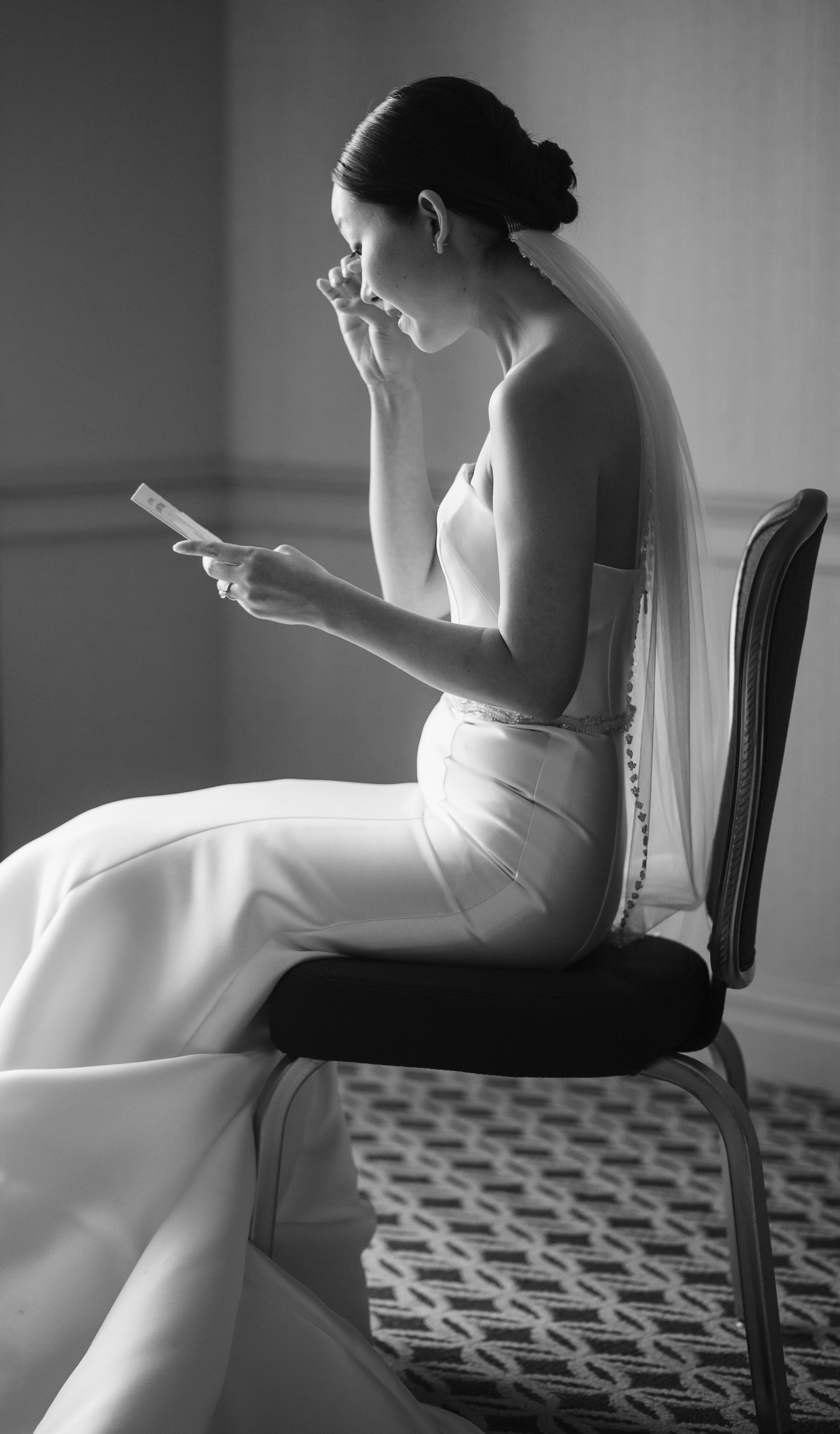 Bride reading a letter before ceremony