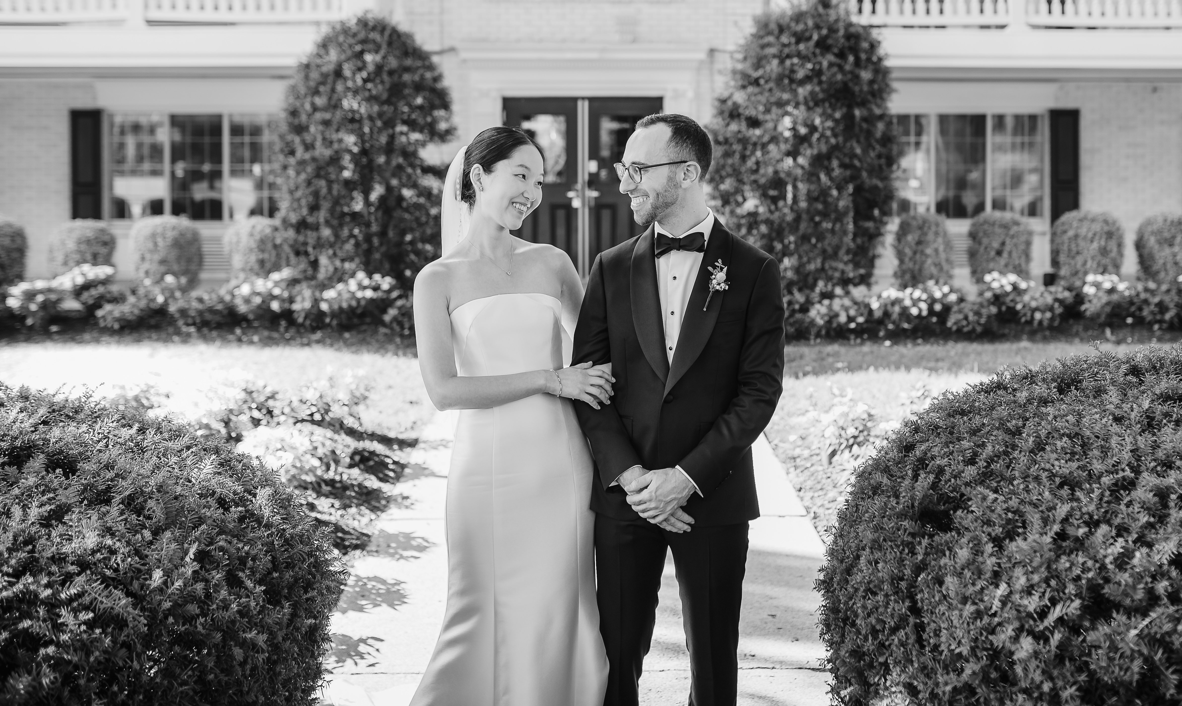 Couple outside venue in black and white