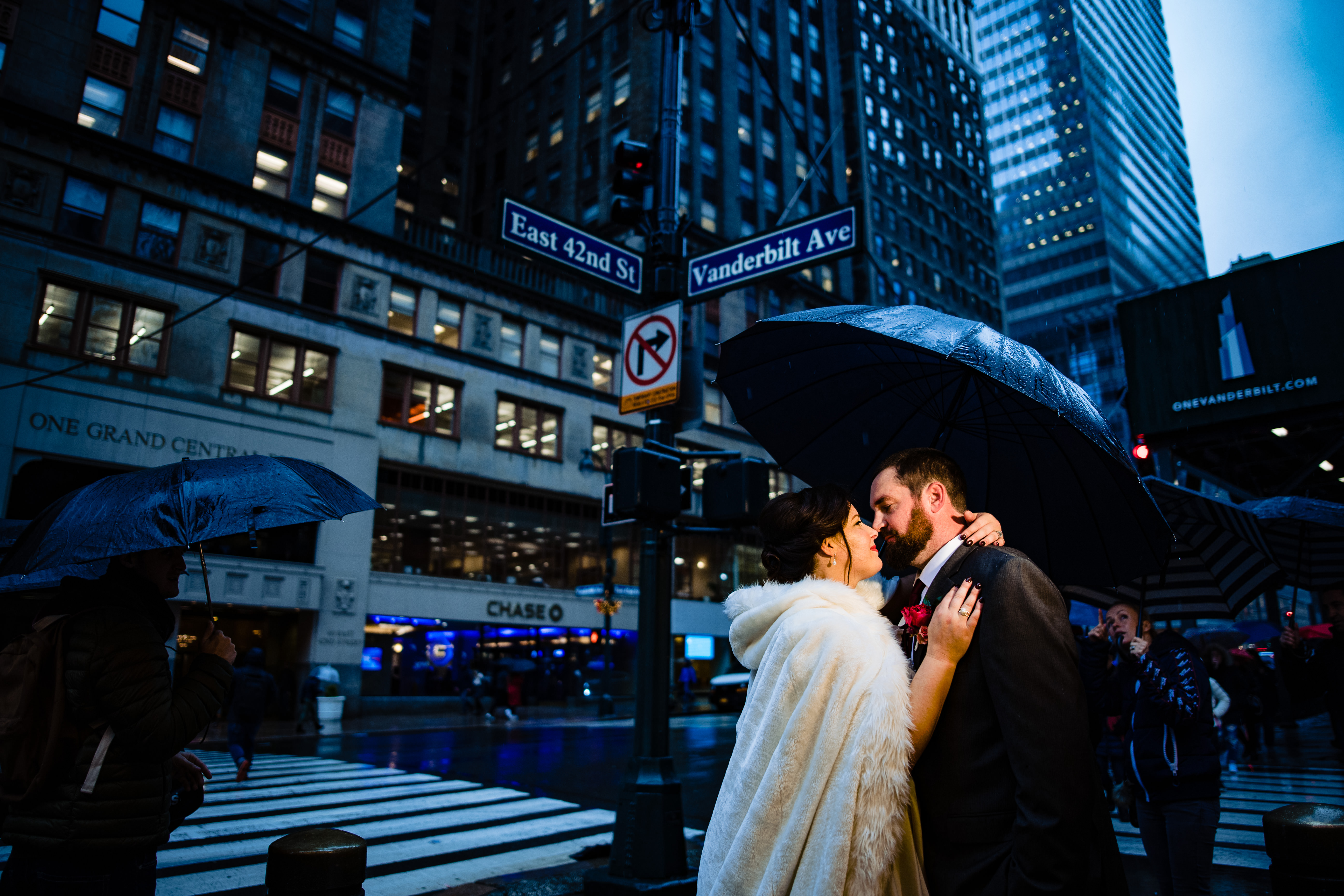 Couple kiss in rain at night, NYC