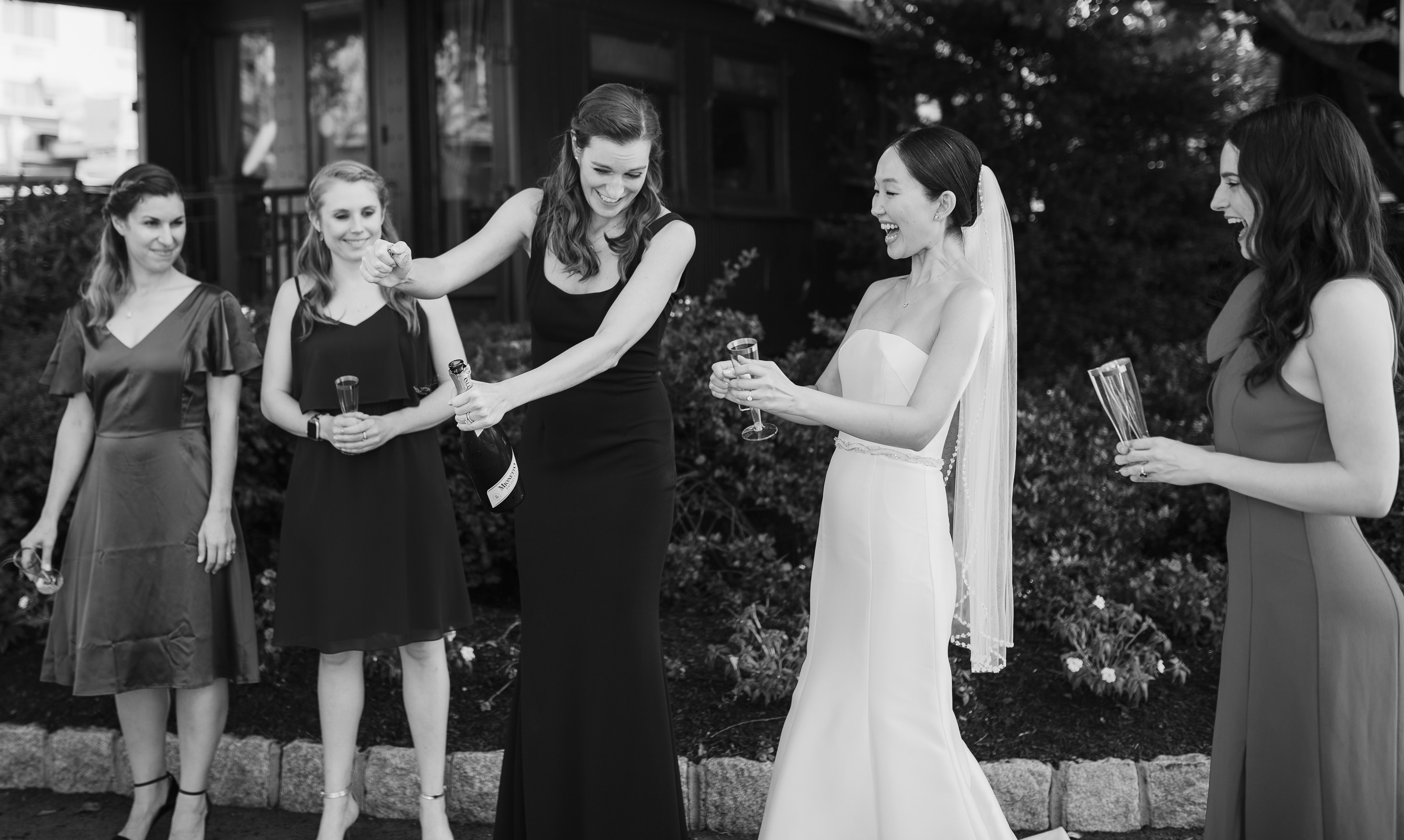 Bride with bridesmaids toasting
