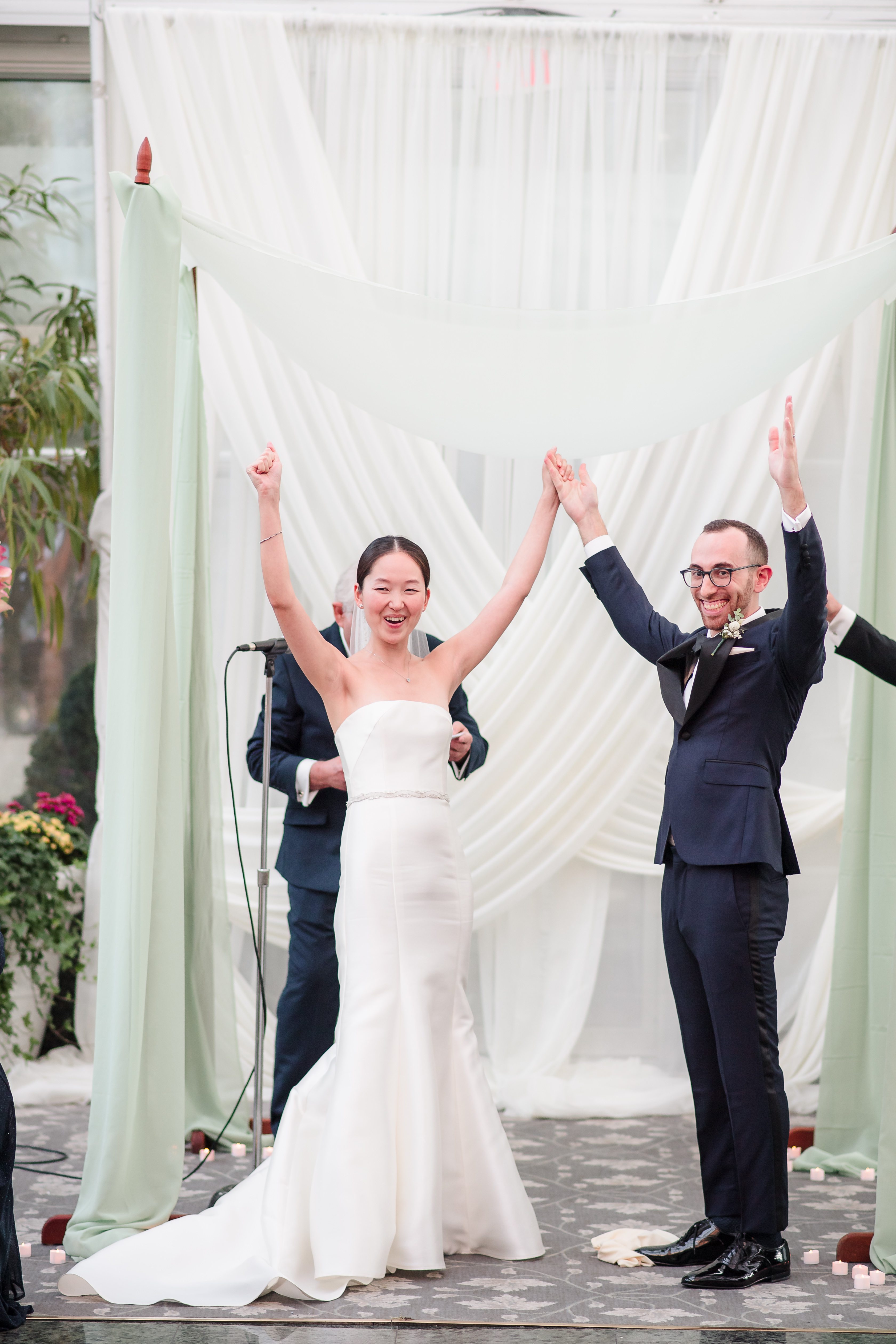 Couple raises hands after ceremony