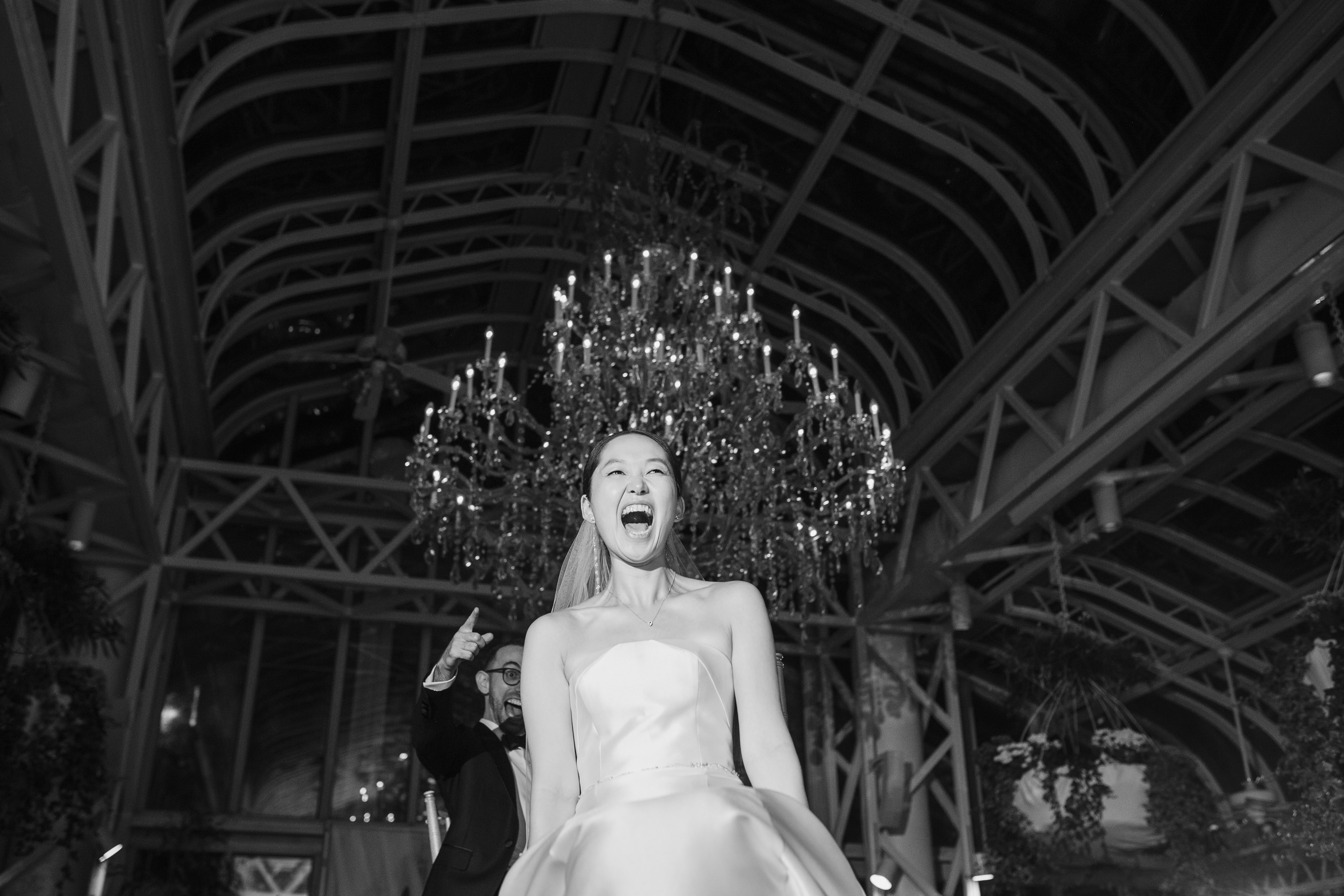 Bride lifted laughing at reception